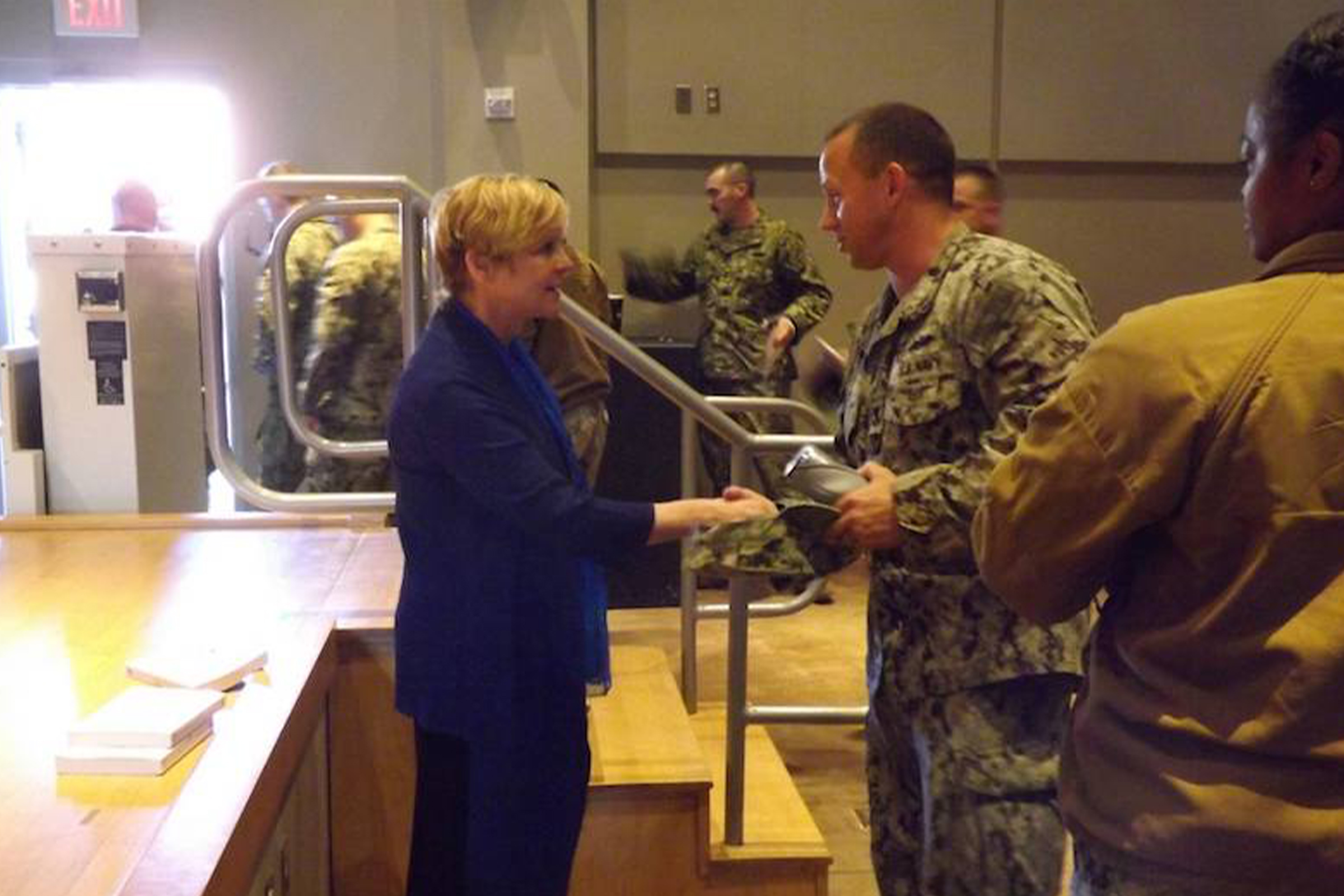 service personnel thanking Janine after a speech