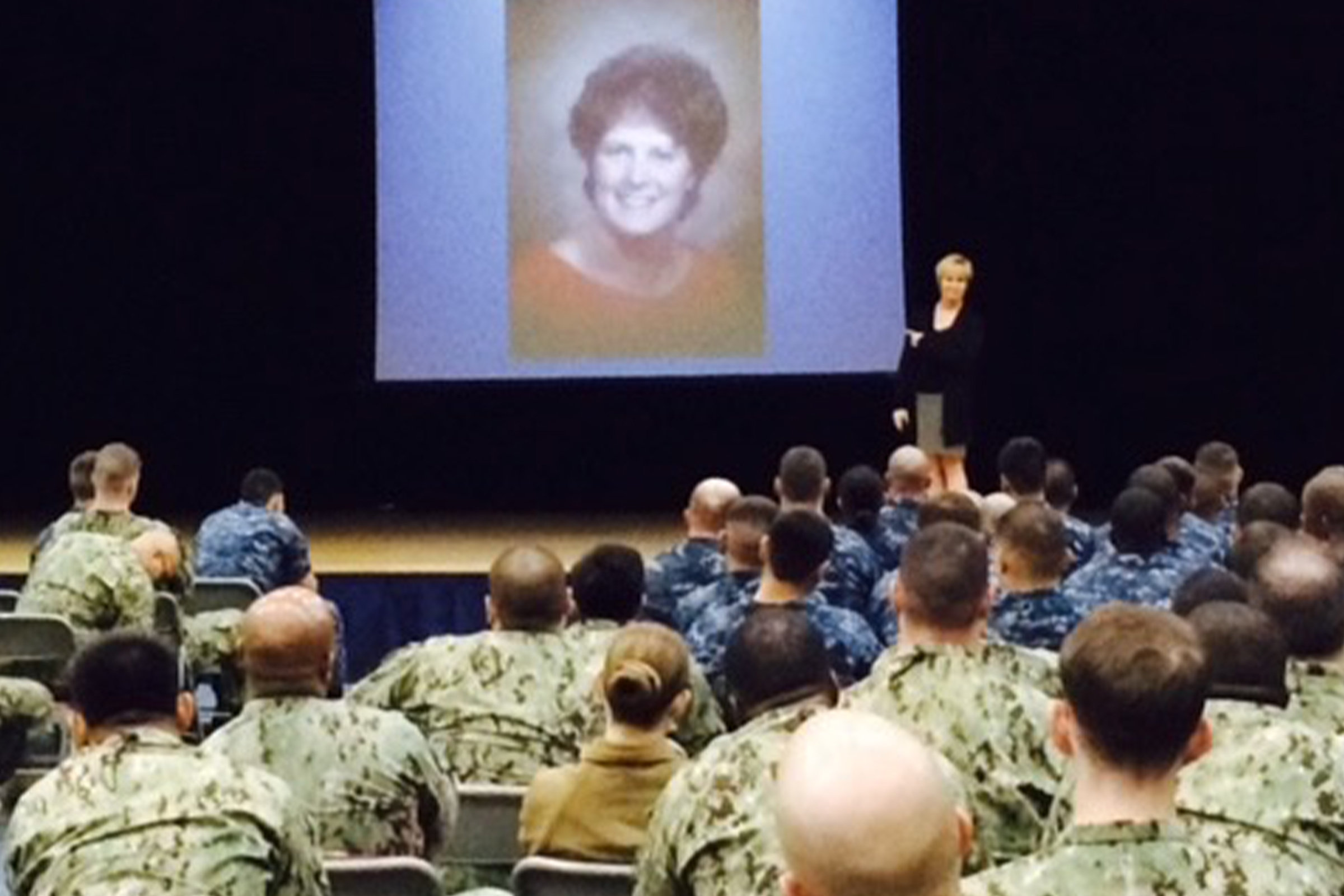 Janine speaking at a military base